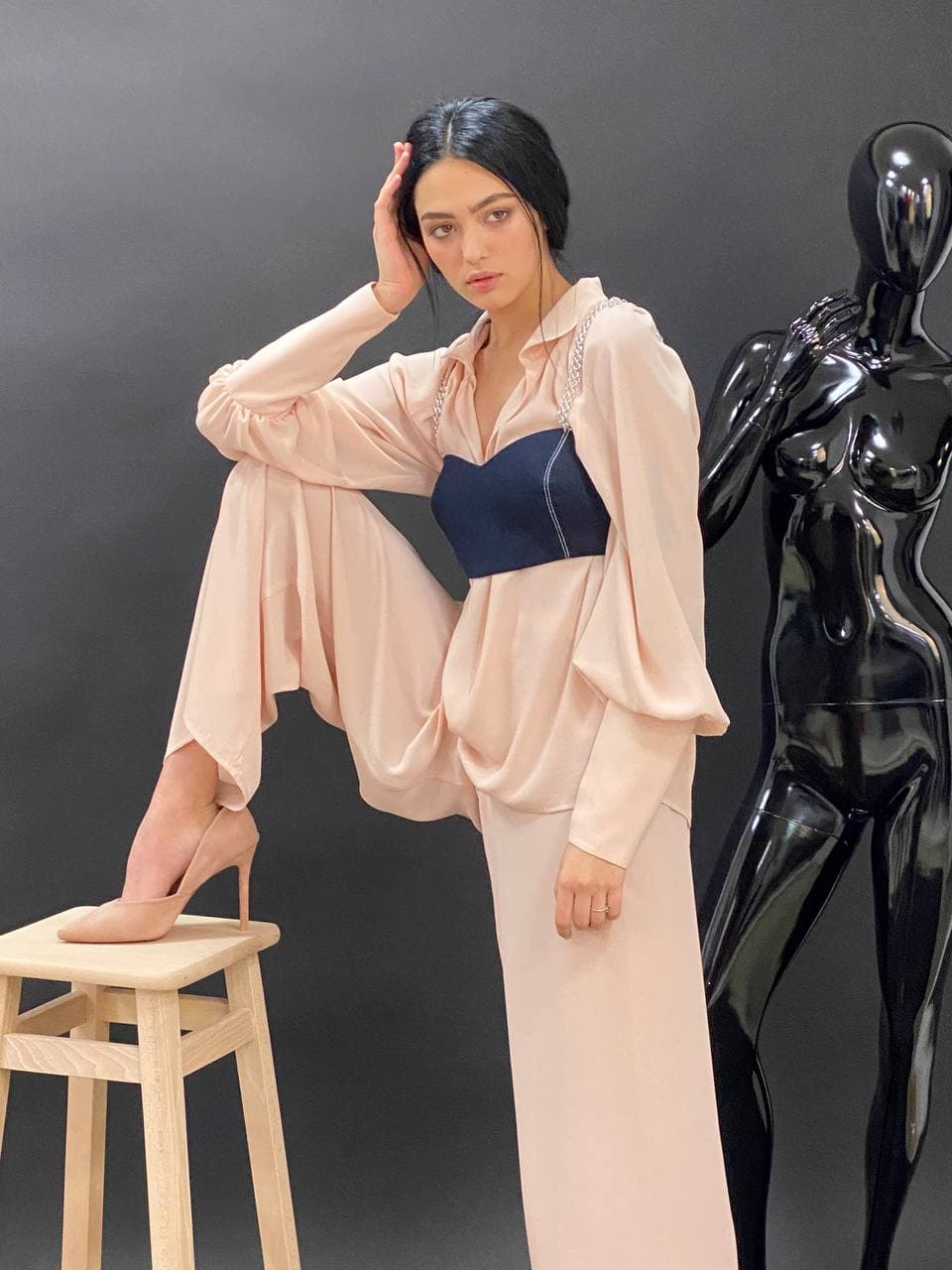 Soft powder-pink blouse and trousers combination styled online